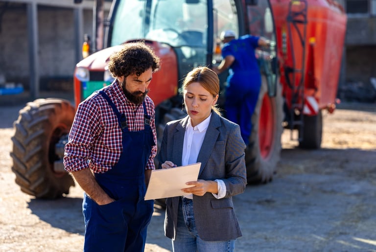 Farmer and business woman discuss farm operations