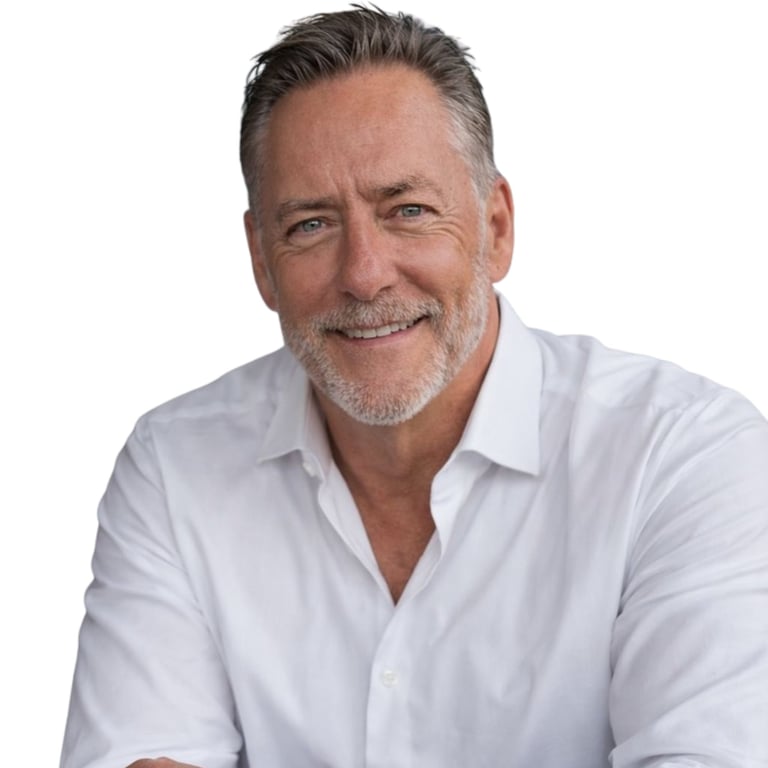 Professional headshot of founder Brian Hess wearing a white button-up shirt